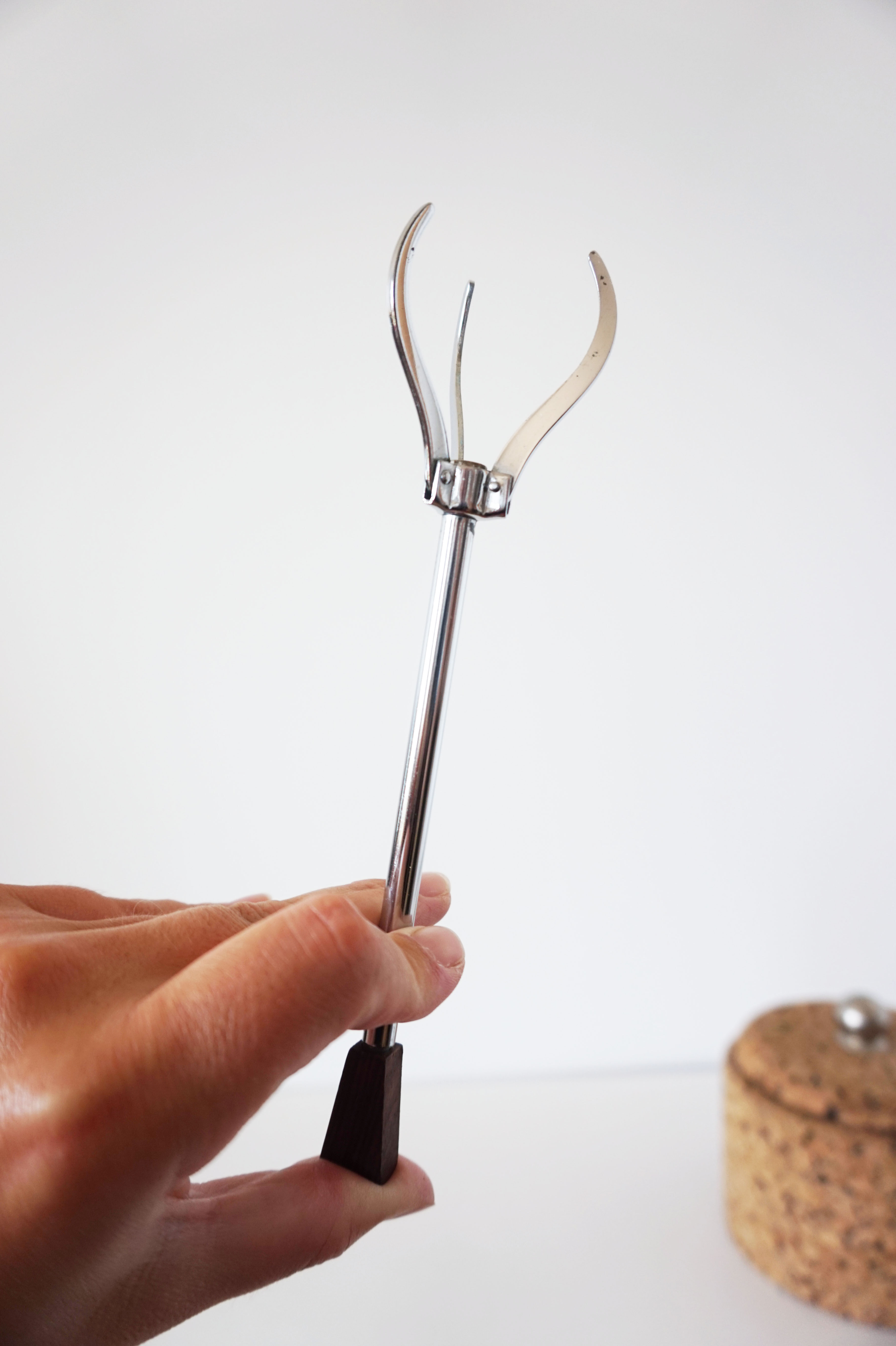 Cork ice bucket and its 1970 ice clip