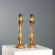 Pair of antique carved and gilded wooden candlesticks, Italy, 19th century.