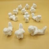 12 porte-couteaux vintage en porcelaine figurant des chérubins