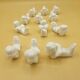 12 porte-couteaux vintage en porcelaine figurant des chérubins