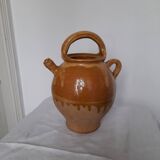 Old enameled ceramic pitcher