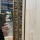 Petit miroir d'entre deux en bois doré
