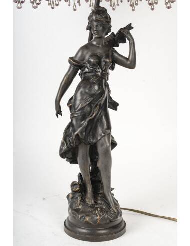 Art Nouveau style lamp with bronze sculpture and glass shade