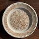 Set of 4 small dessert plates with a vintage stylised flower pattern.