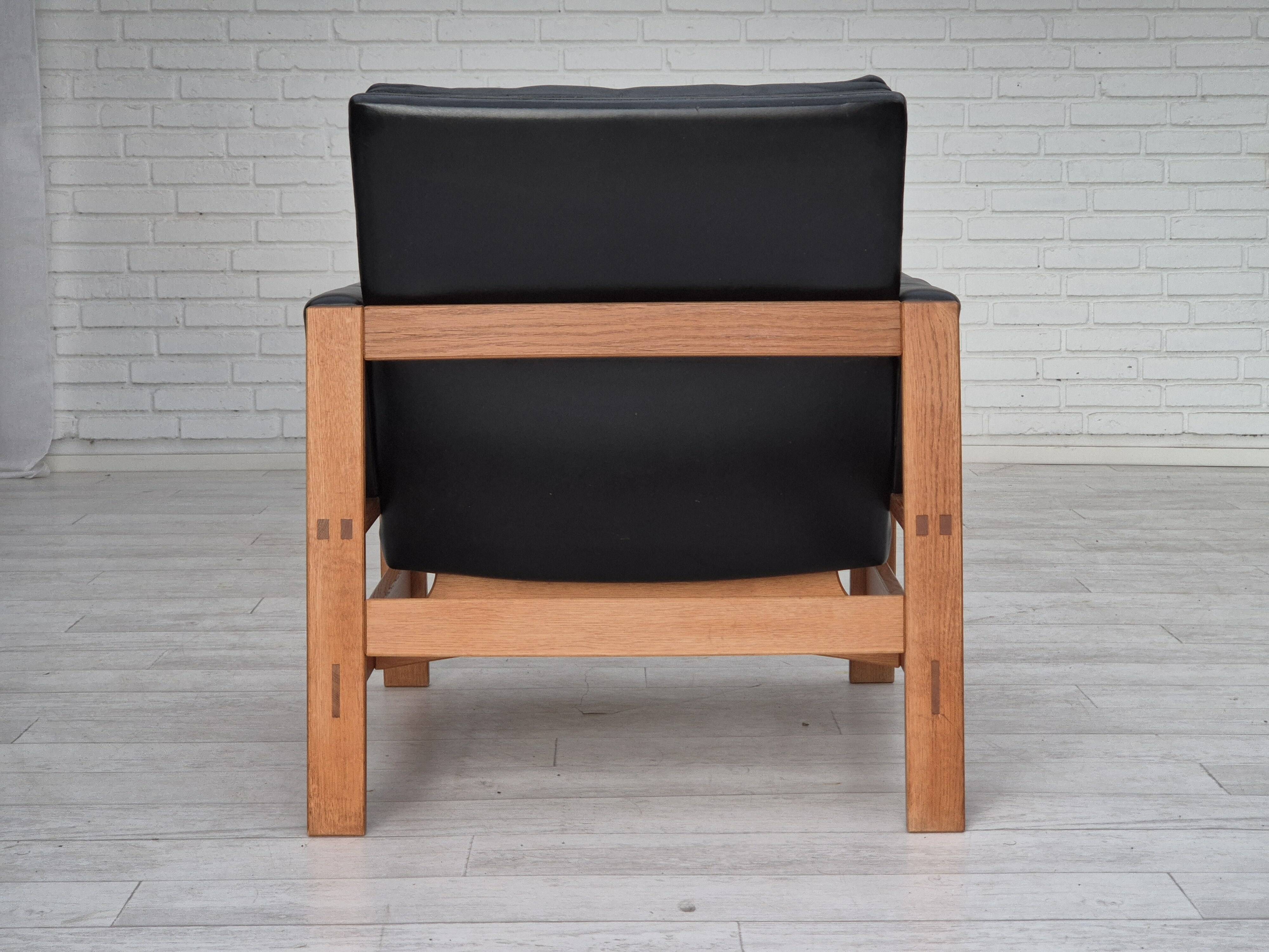 1960s, Danish lounge chair, original condition, furniture leather, solid oak wood.