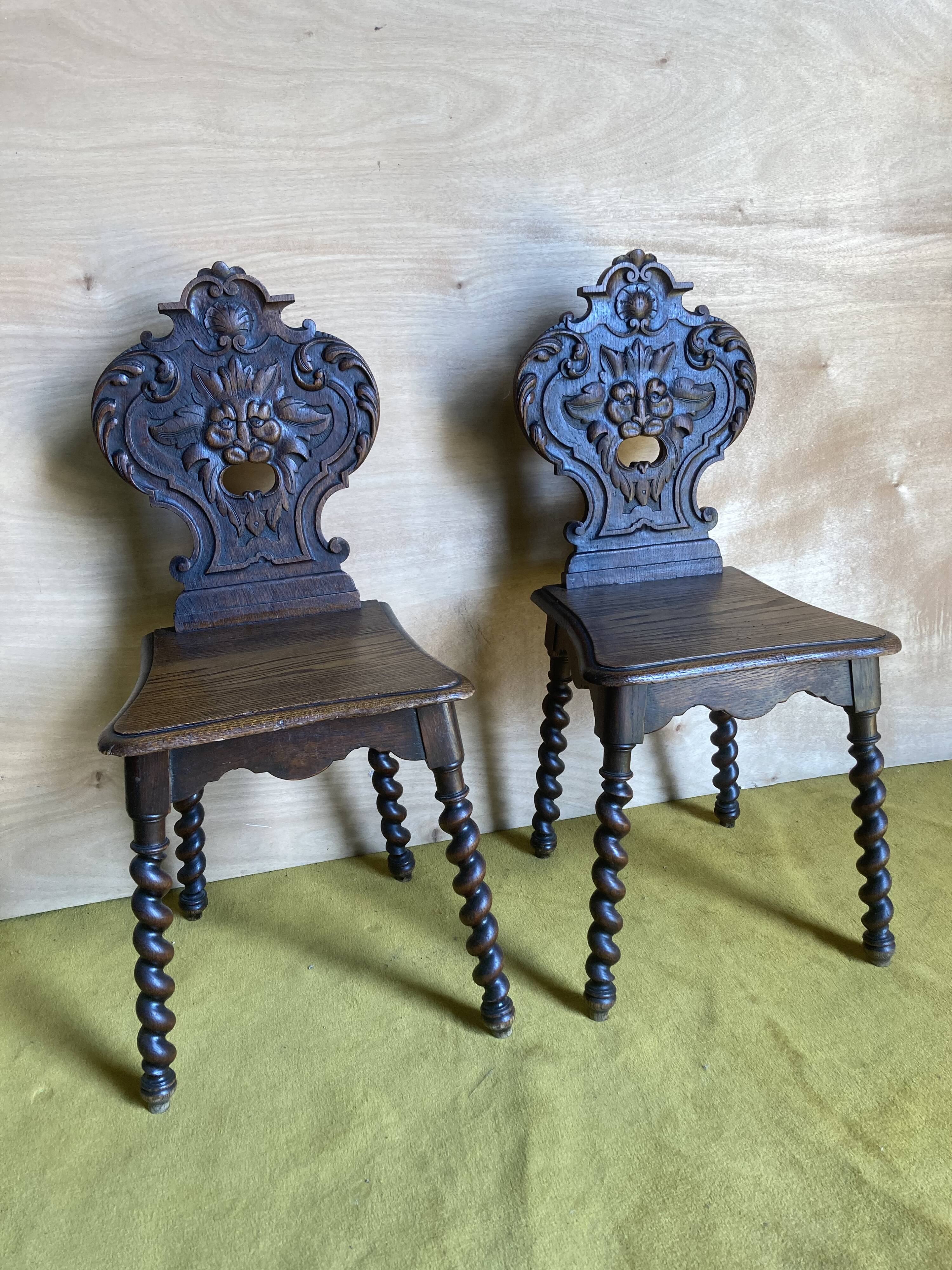 Duo of carved wooden chairs