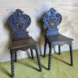 Duo of carved wooden chairs