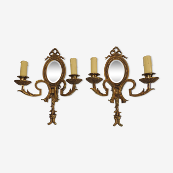 Pair of Louis XVI style bronze wall lamps