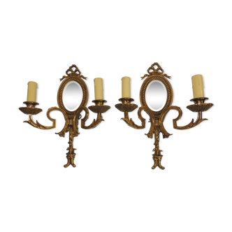 Pair of Louis XVI style bronze wall lamps