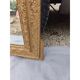 19th-century mirror in gilded wood and stucco.