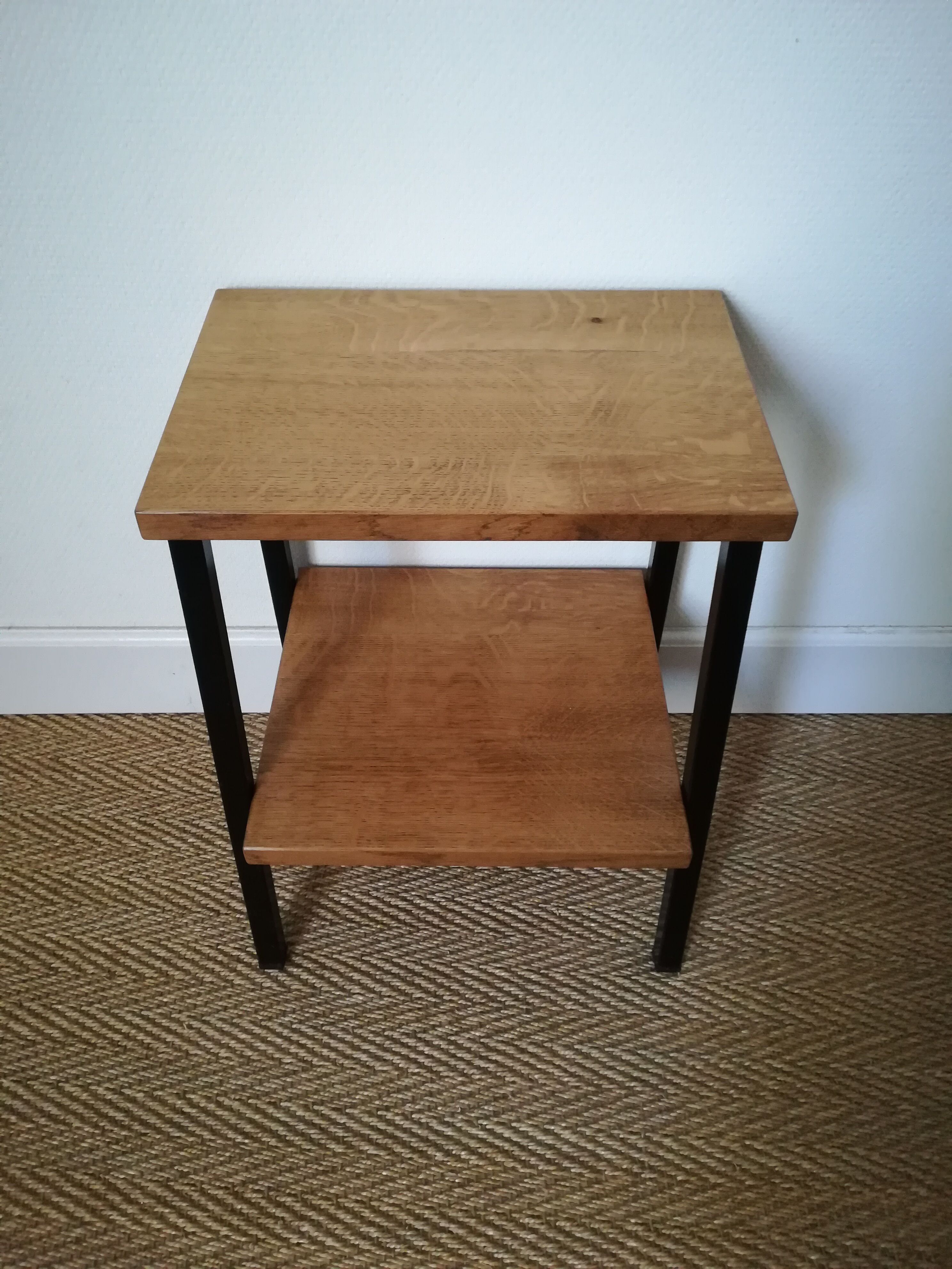 A pair of bedside tables