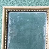 Mercury mirror, carved wood