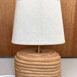 Oval table lamp in handcrafted ceramic with draped effect.