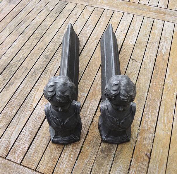 Antique cast iron fireplace andirons: bust of a garçonne