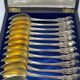 12 dessert spoons in vermeil, Minerva 19th century, blackened pear tree box