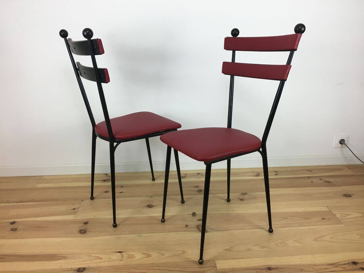 Pair of 1950s chairs in metal and red faux leather, Gueden-Adnet style.