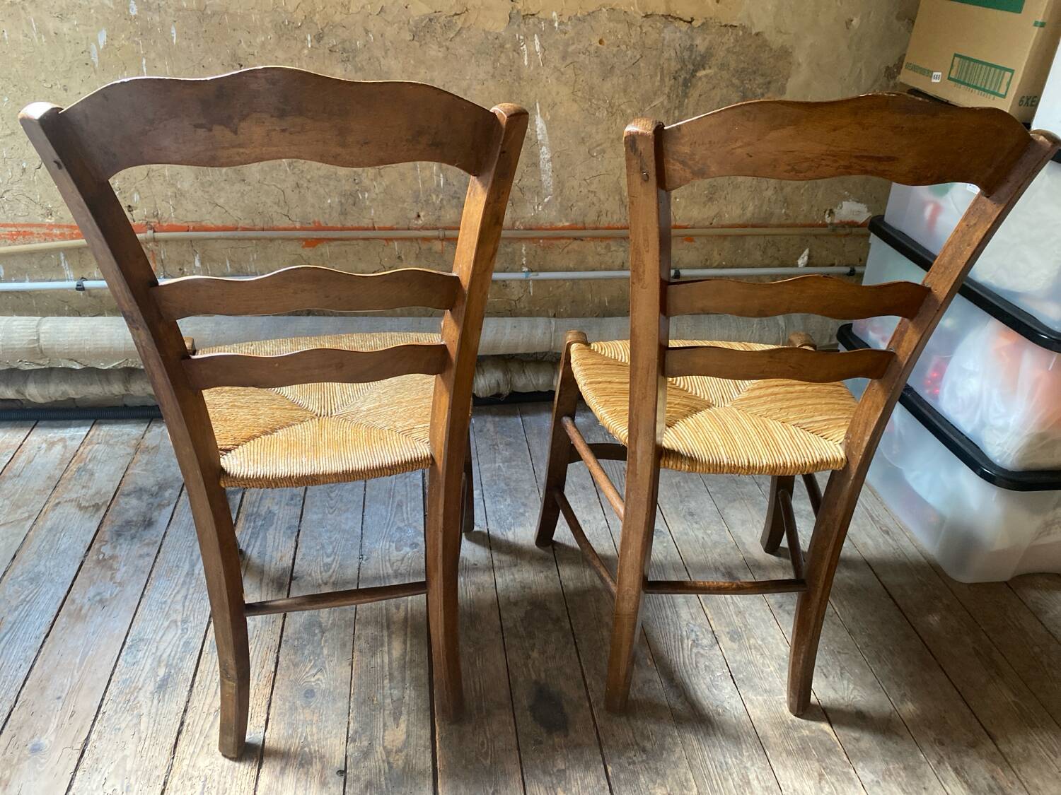 2 wooden chairs with cane