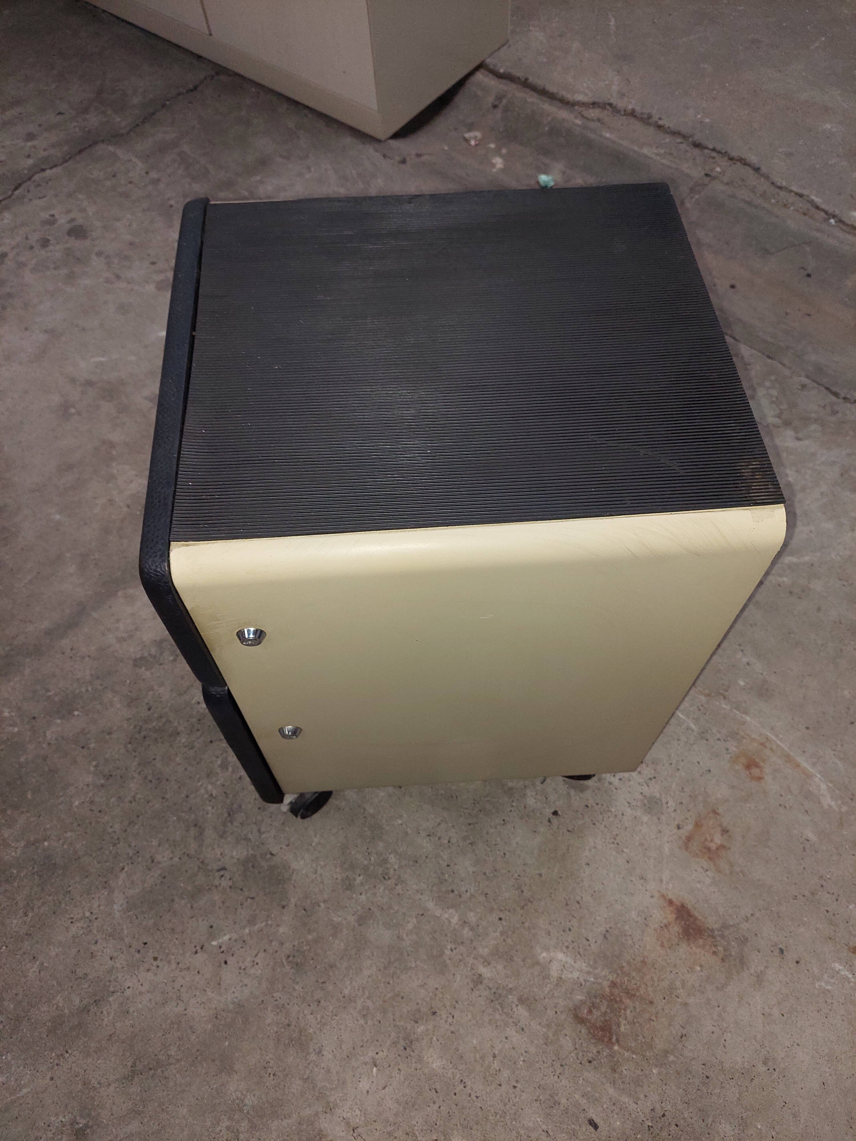 Metal box with used vintage keyless casters