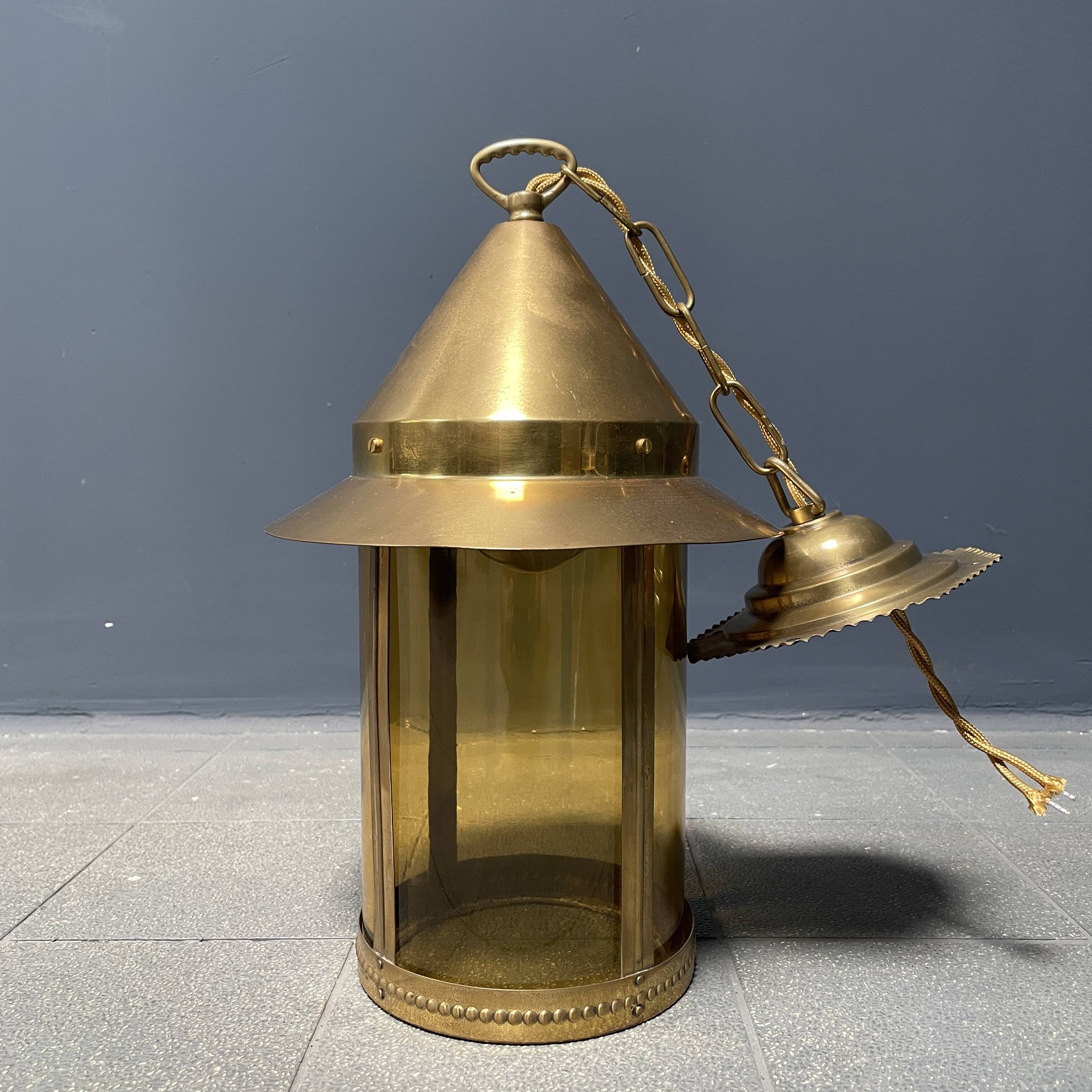 Brass lantern pendant lamp with yellow glass