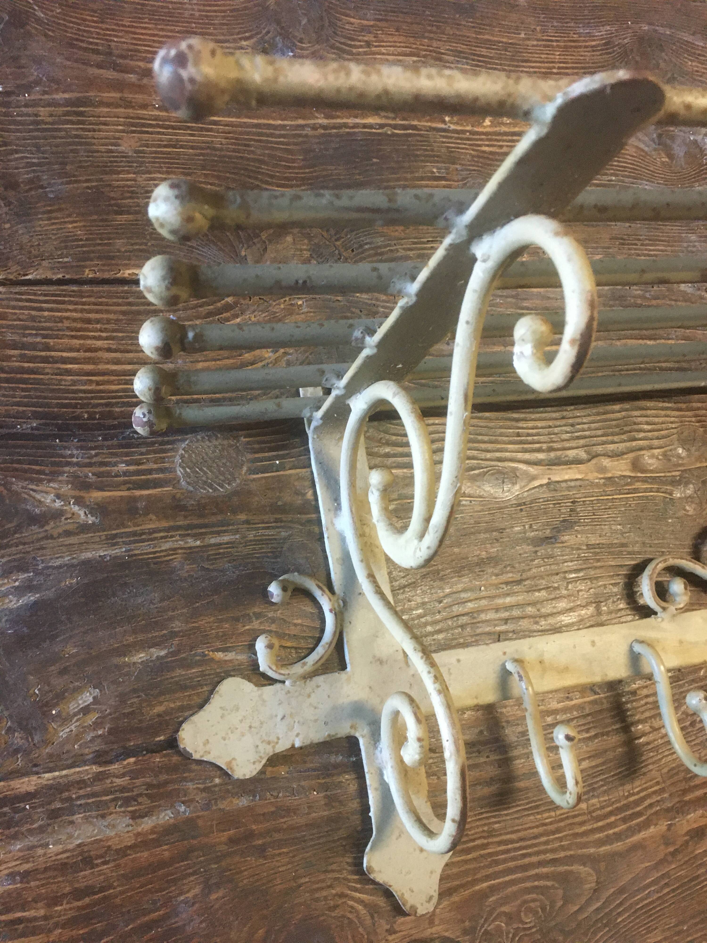 White wrought iron coat and hat rack