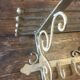 White wrought iron coat and hat rack