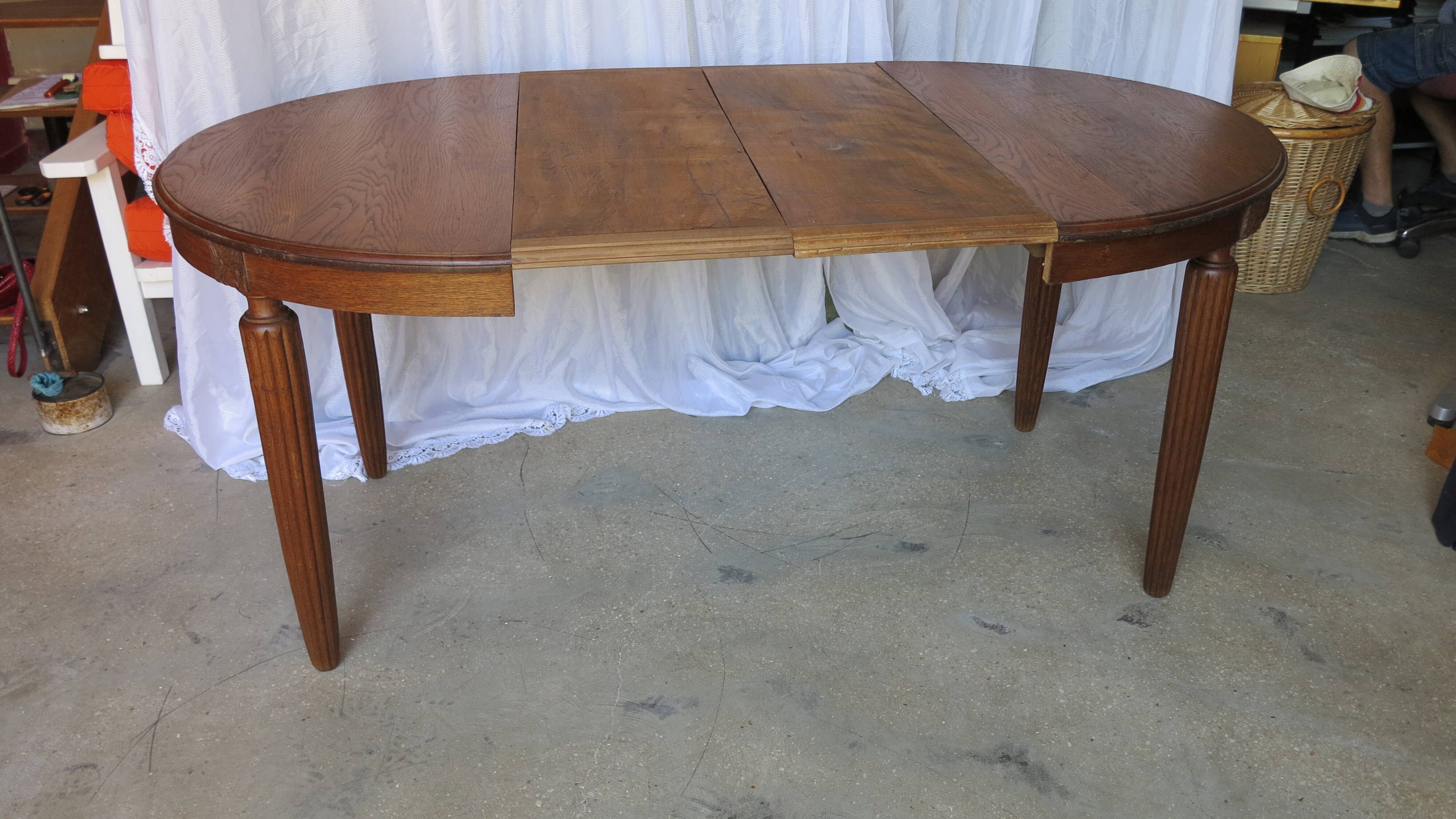 1930s oak dining table, slightly oval.