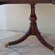 Mahogany top table inlaid with light wood nets and brass toes