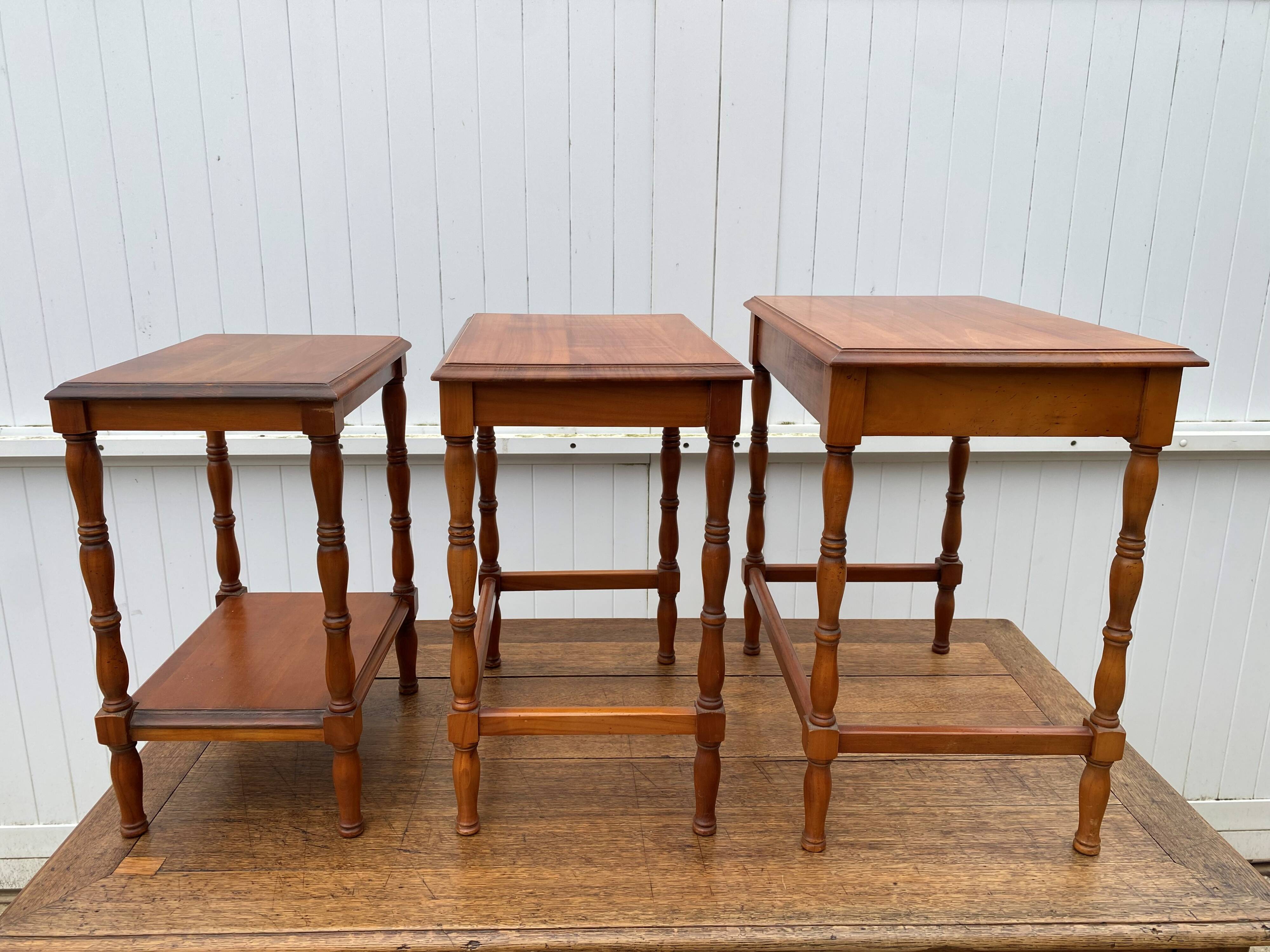 Set of 3 rustic cherry wood nesting coffee tables from the 1950s.