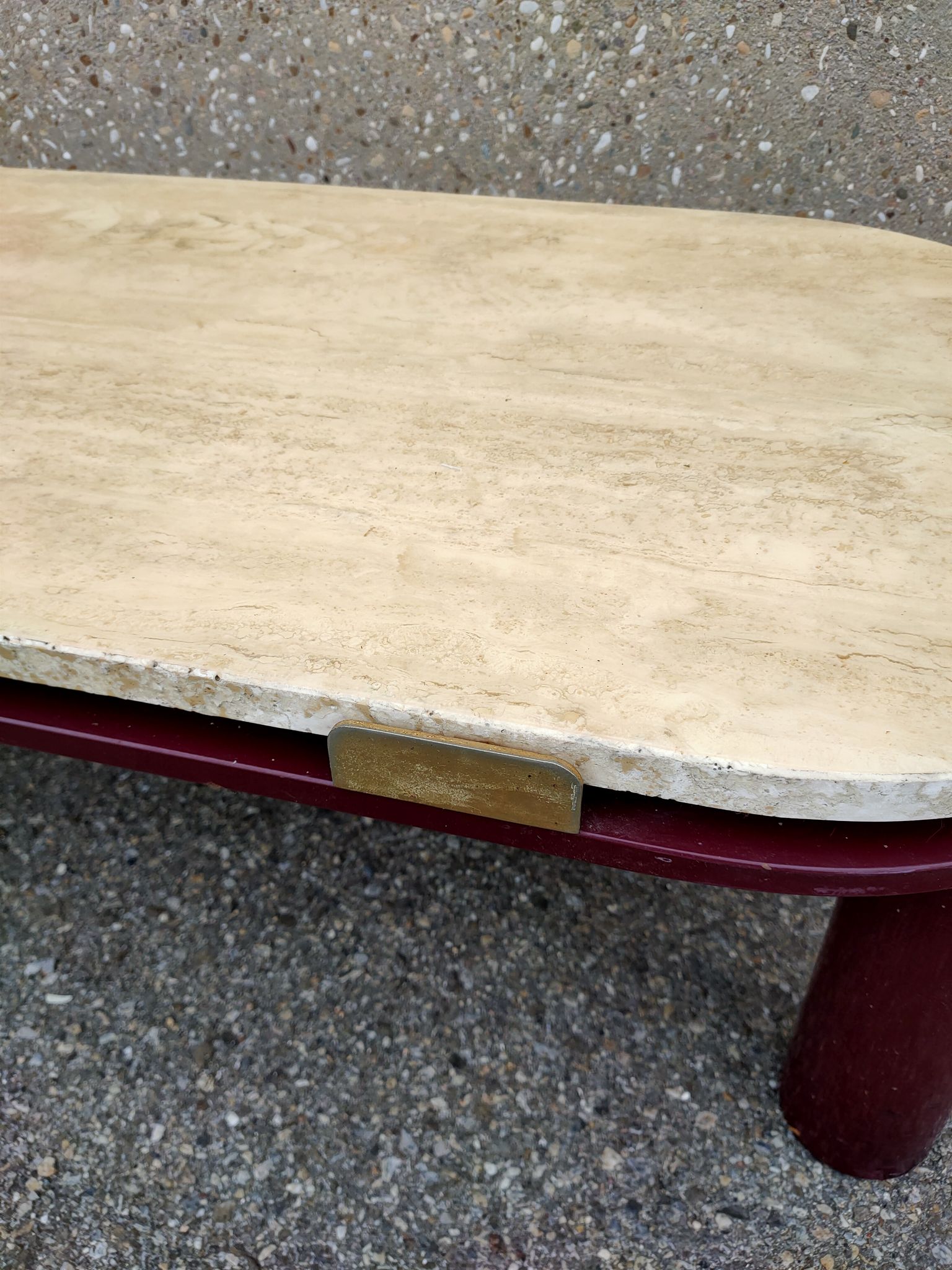 Coffee table Travertine top, garnet-colored metal stand and legs.  Long