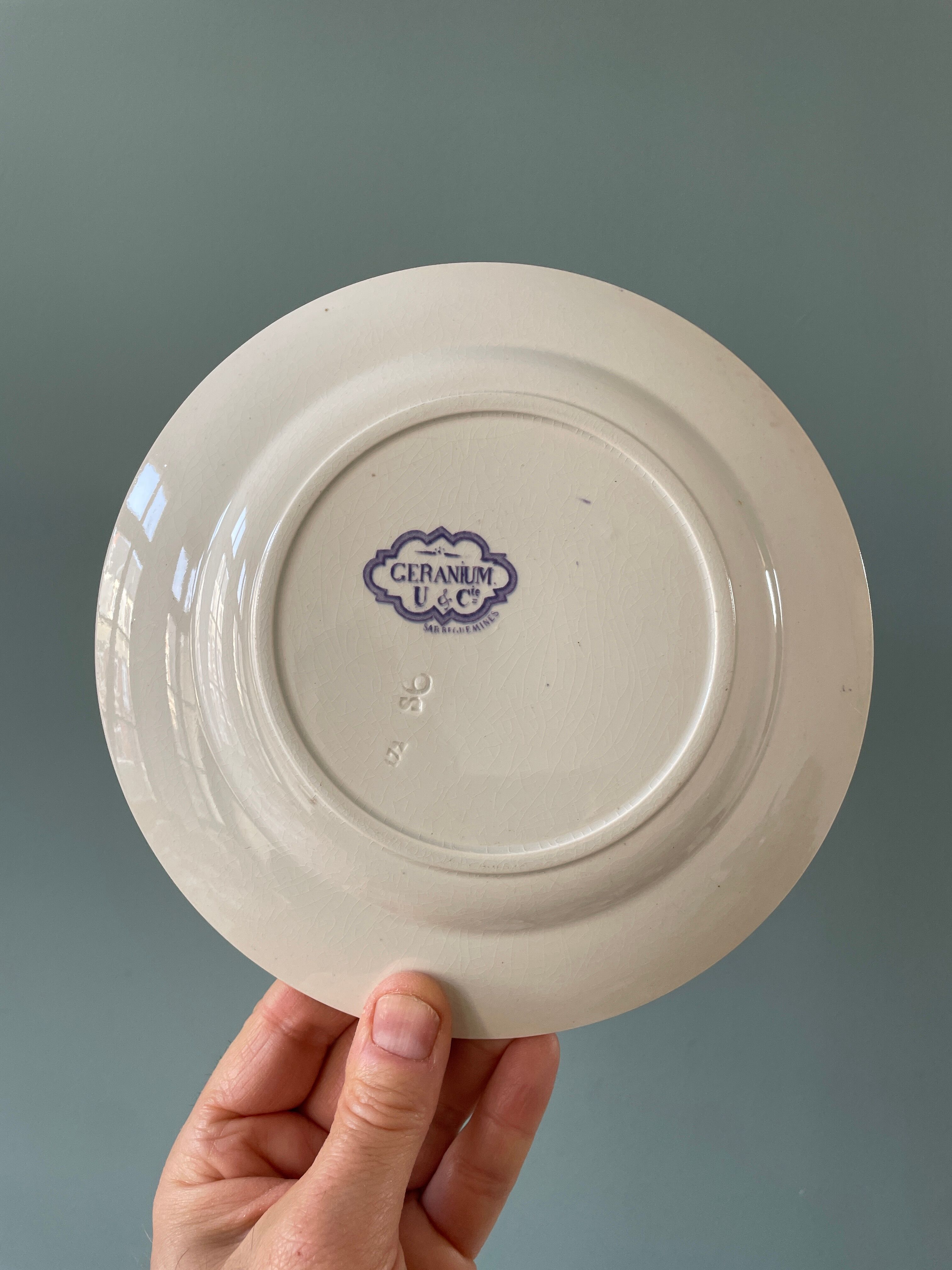 Series of 12 mismatched Terre de Fer dessert plates