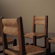 Set of four modernist chairs in oak and straw, France, circa 1960.