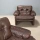 Pair of brown leather armchairs "Coronado"