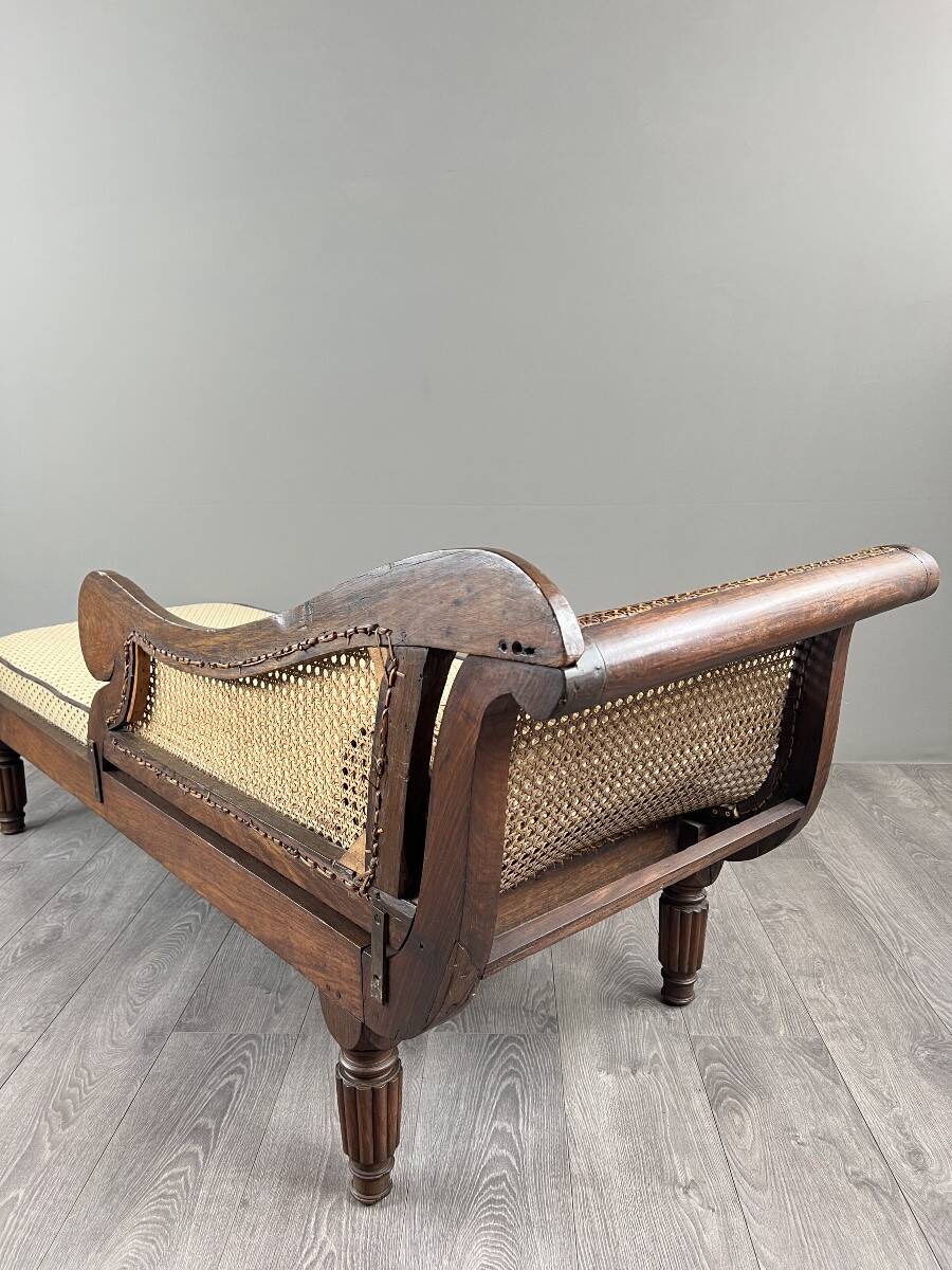 Louis XVI style meridian in carved wood and caning, 19th century.