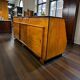 Vintage wooden shop counter with display case