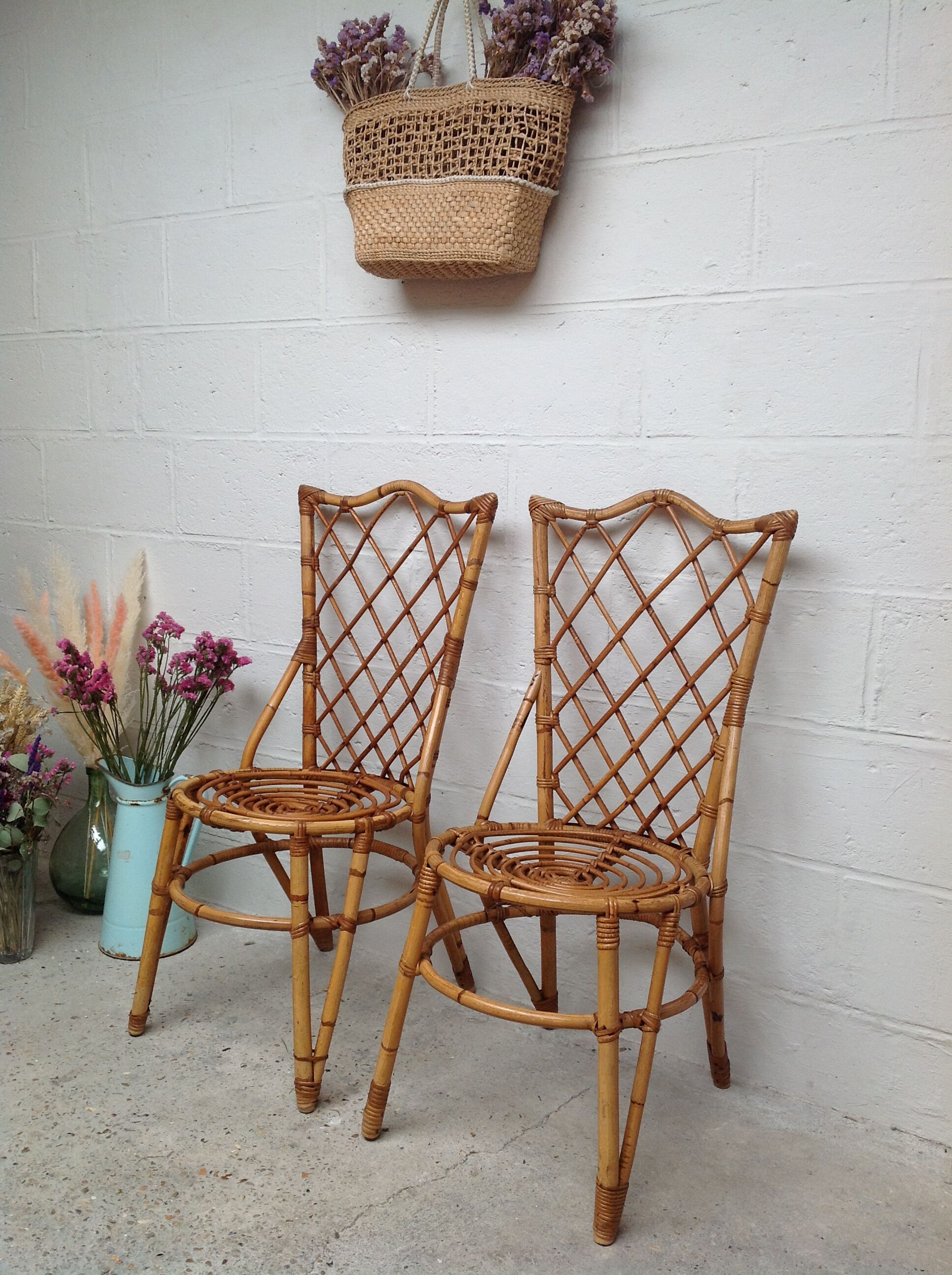 Pair of rattan chairs by Louis Sognot