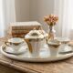 Coffee and tea service for two with its tray in Limoges porcelain.