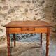French vintage side table in cherry wood with a drawer.