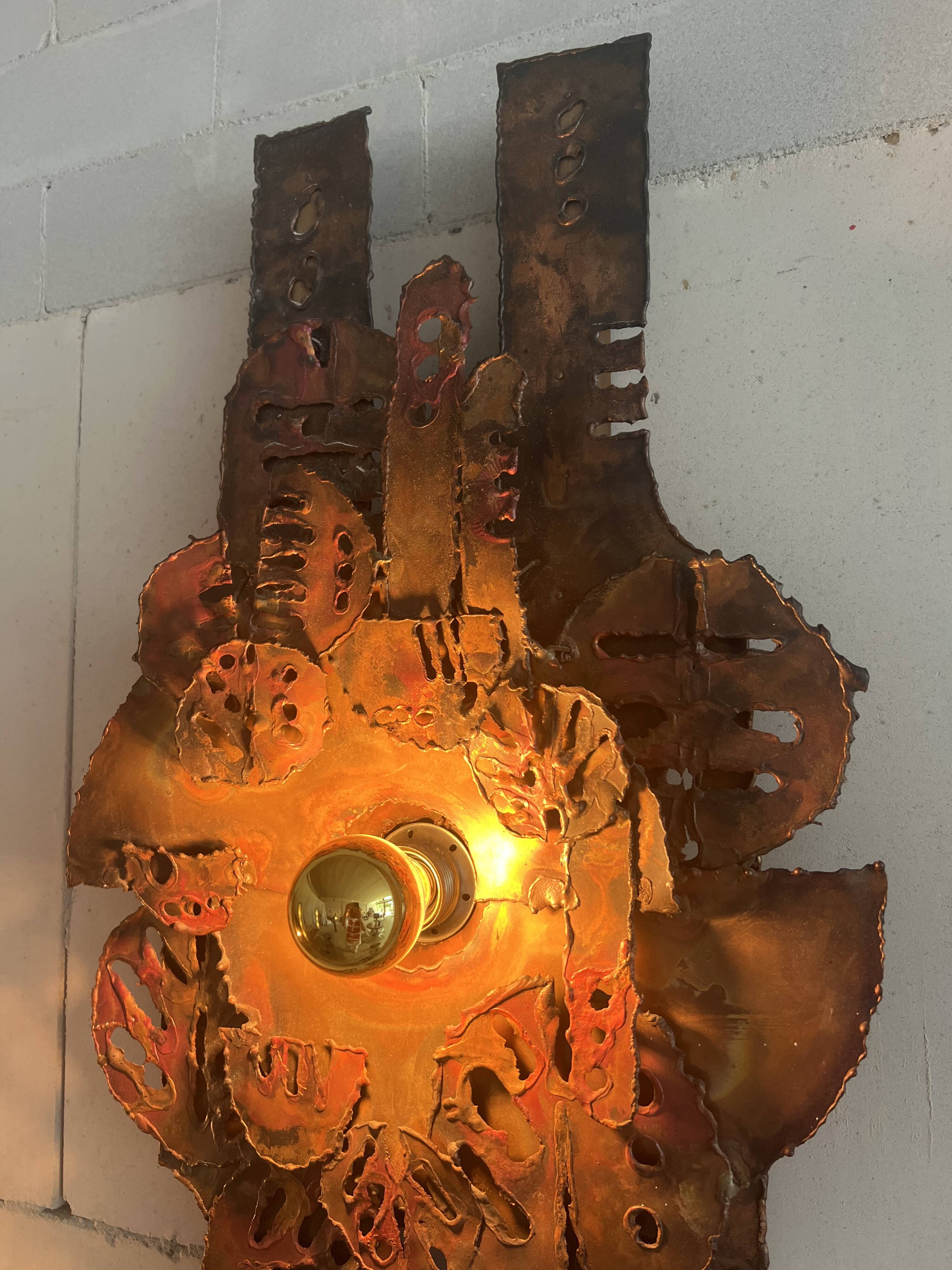 Raw expressive wall sconces by Francesco Pasinato