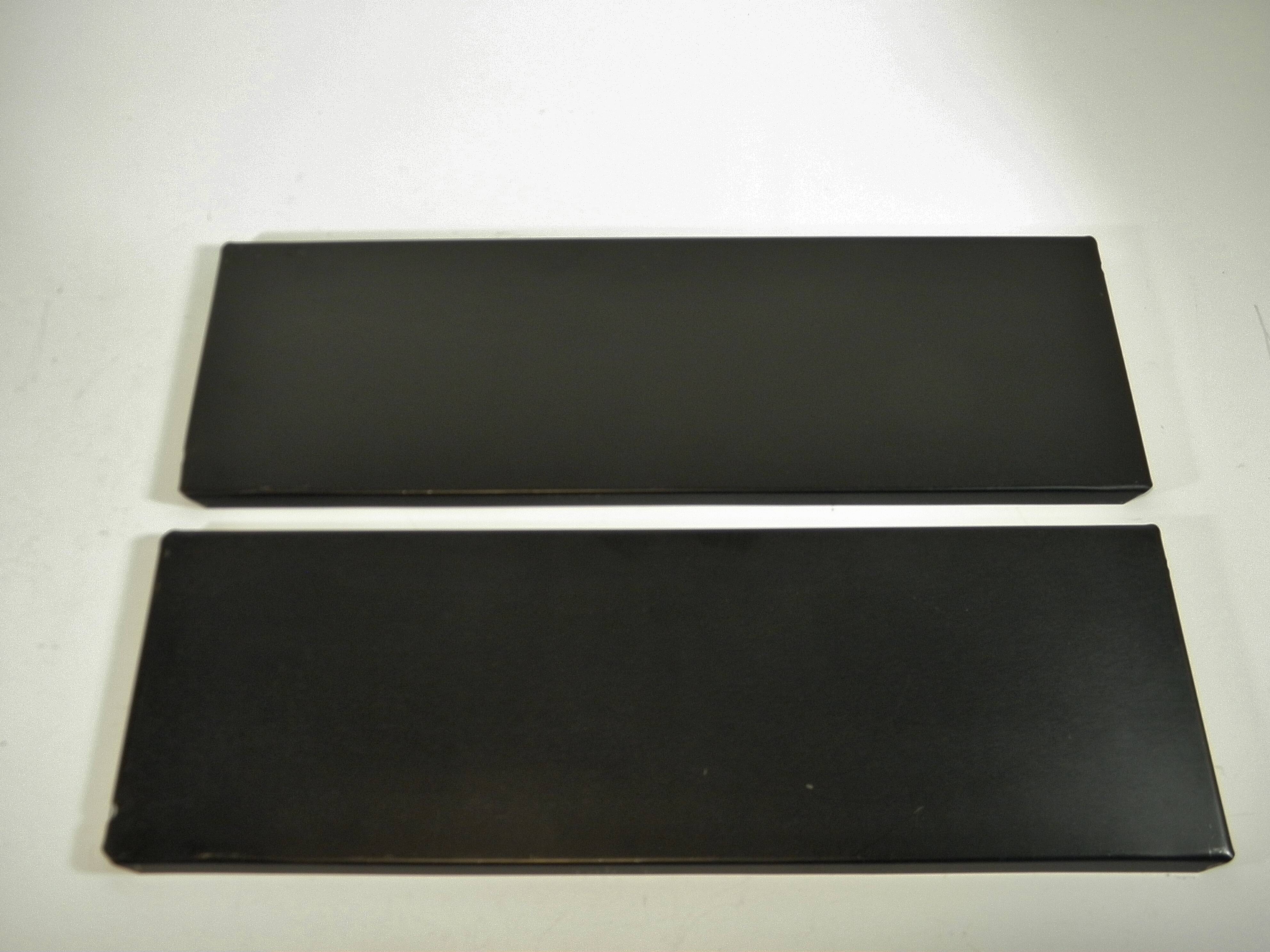 Black and gold metal wall shelf from the 1960s