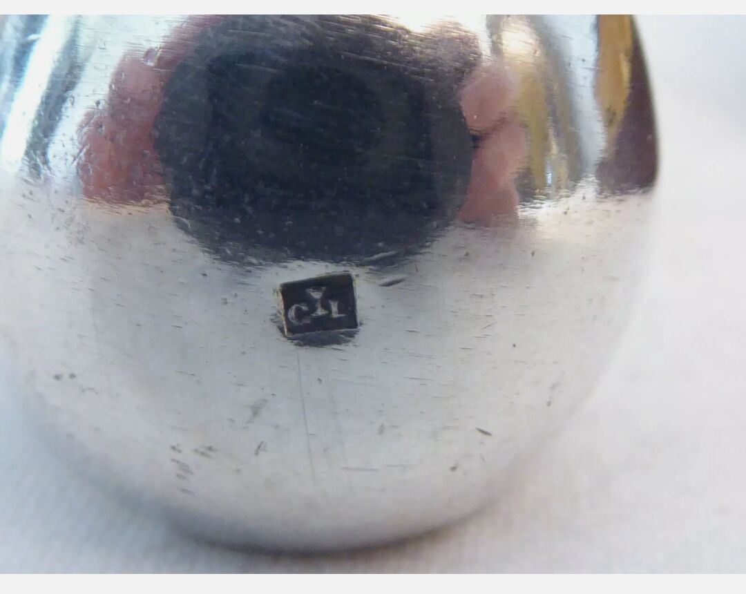 Silver metal sugar clamp in its case