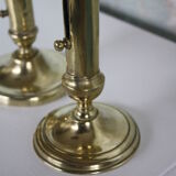 Pair of brass push-up candlesticks