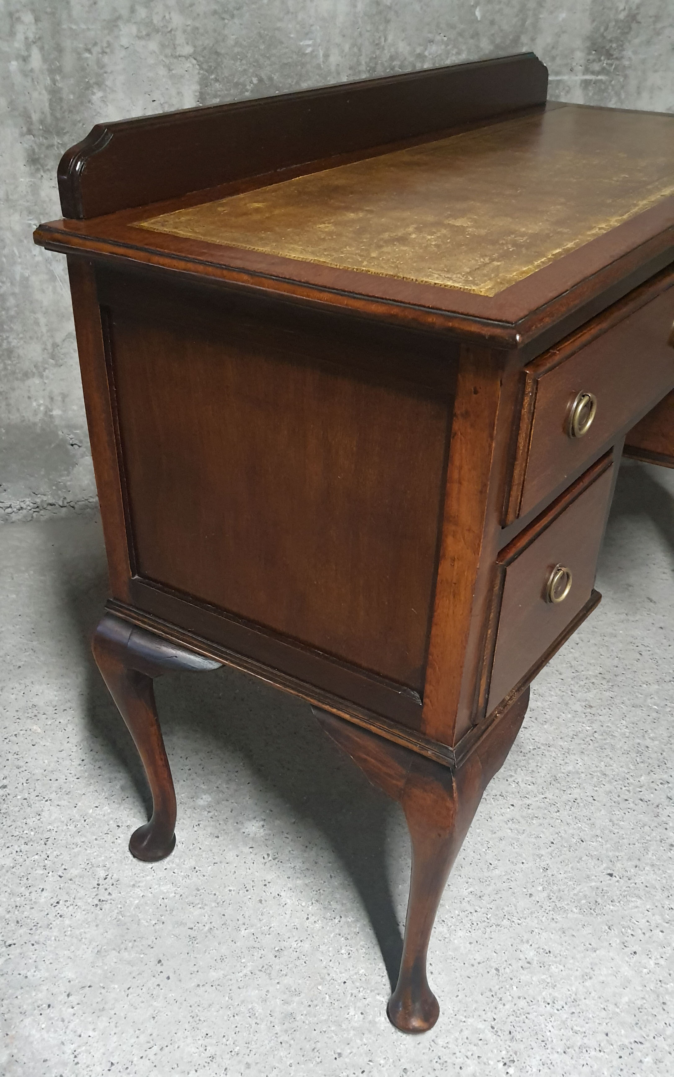 Old desk in cherry and green leather
