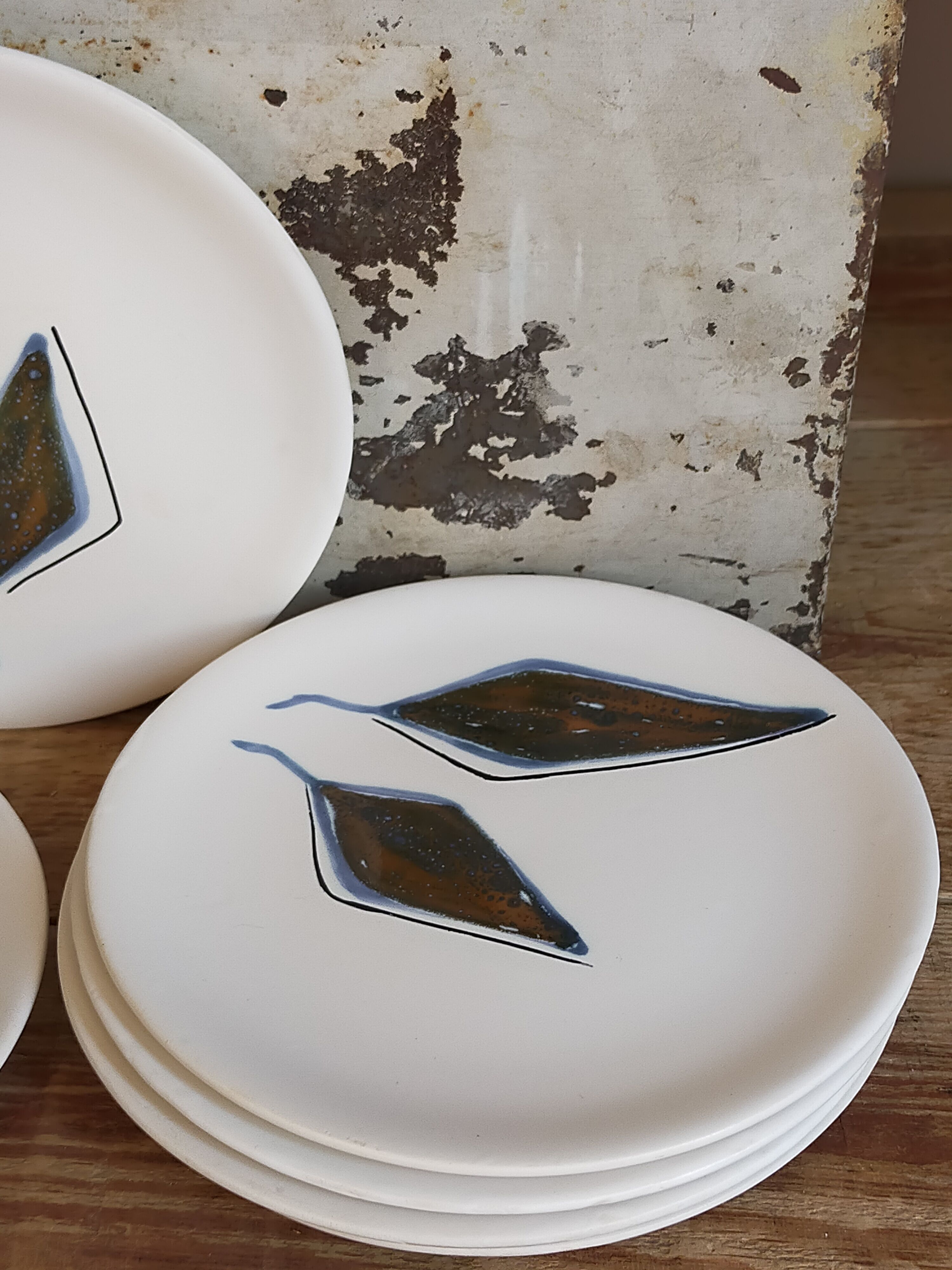 Six ceramic plates with matt enamel 50s