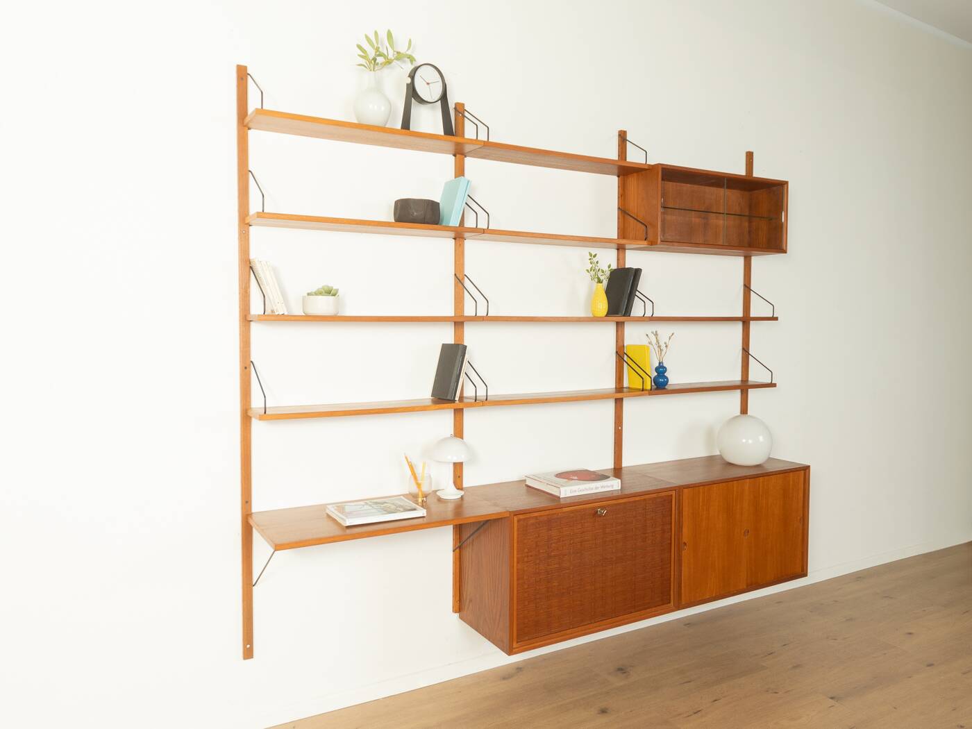 Classic shelving system from the 1950s in teak veneer by Poul Cadovius for Cado