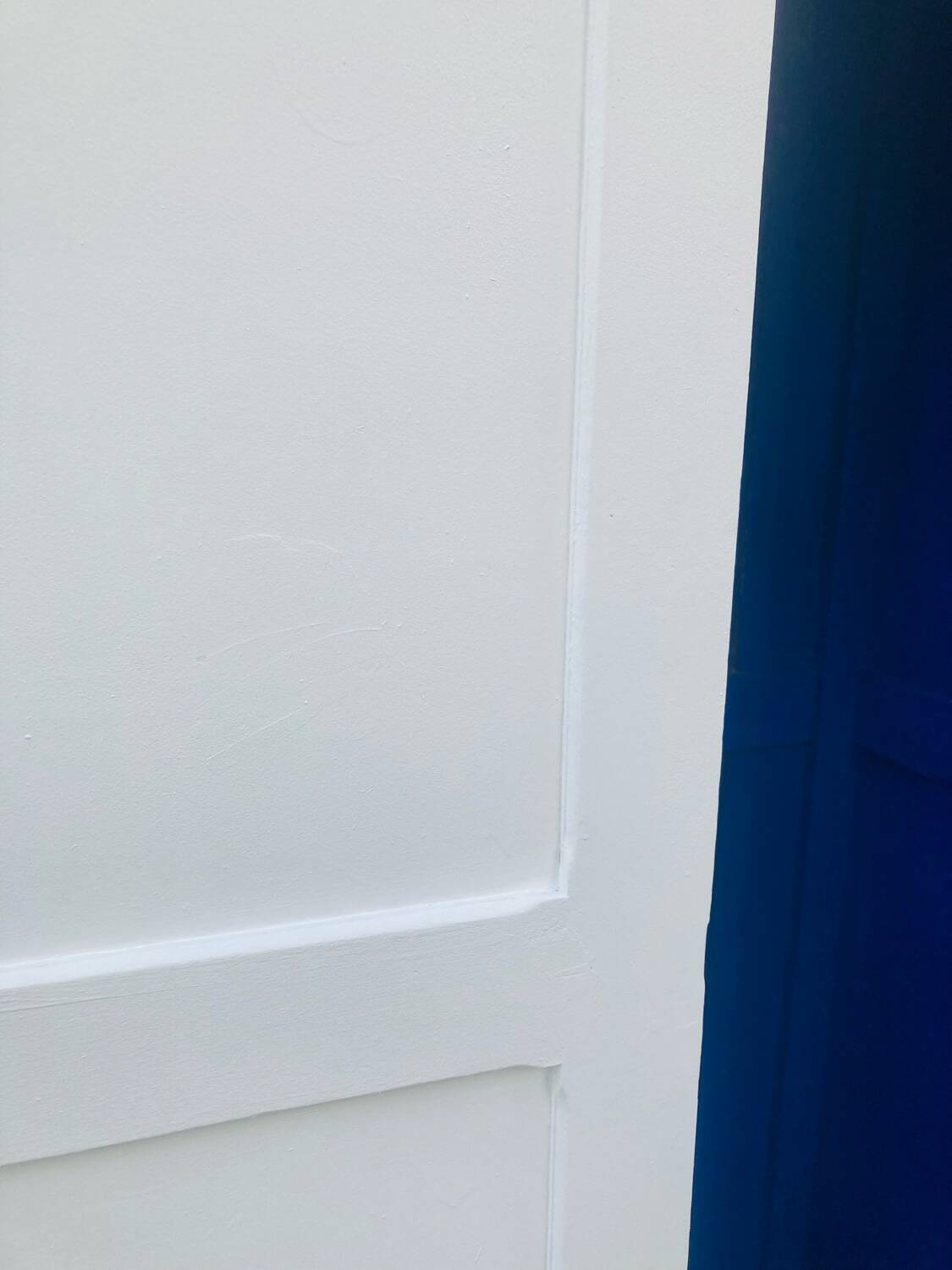 Antique white Parisian wardrobe with Majorelle blue interior