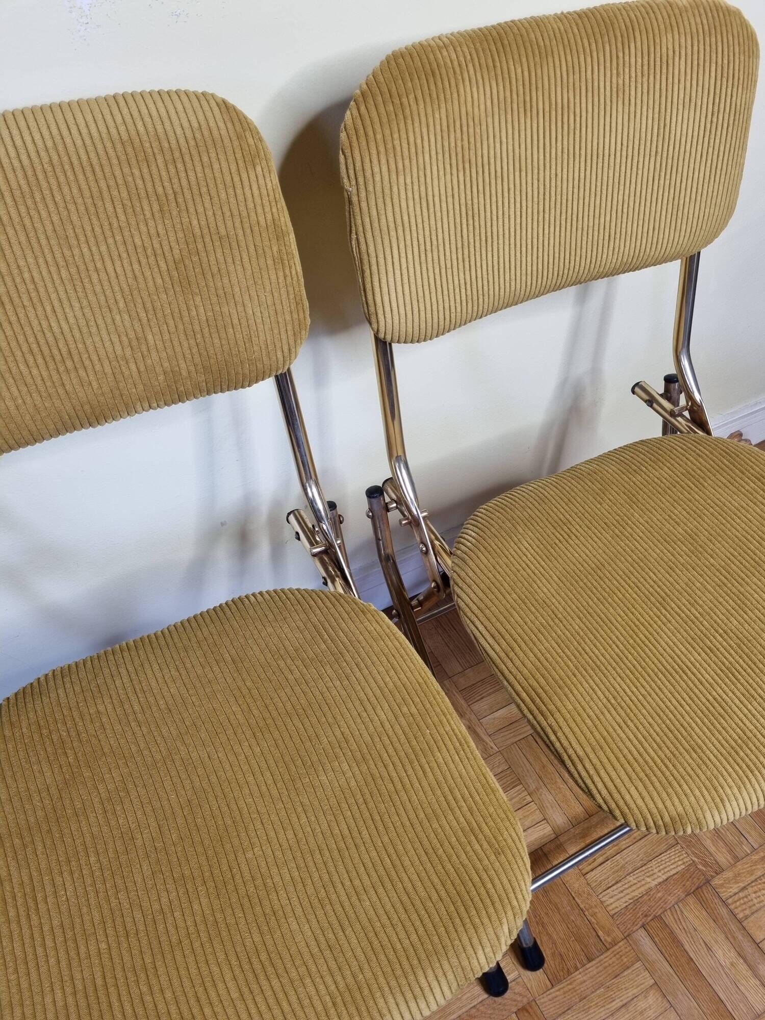 Pair of vintage folding chairs in gilded metal and 70s fabrics, restored
