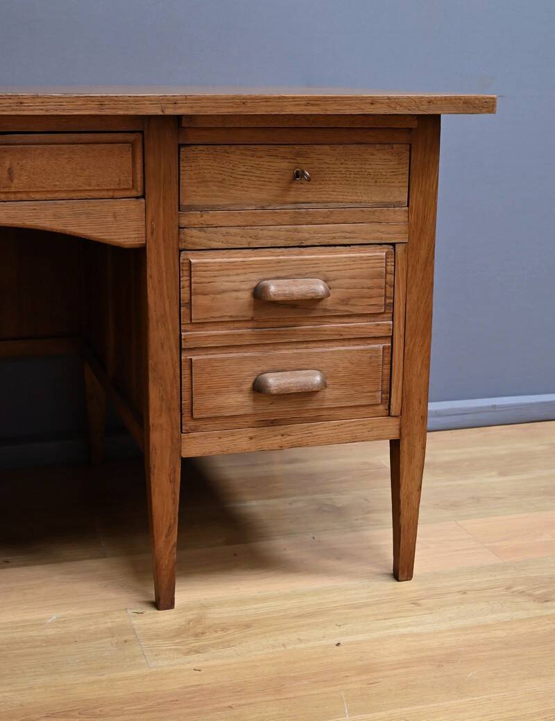Solid oak pedestal desk, Régy establishments – 1940