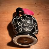Pretty Vallauris pitcher in black and pink glazed ceramic white reliefs