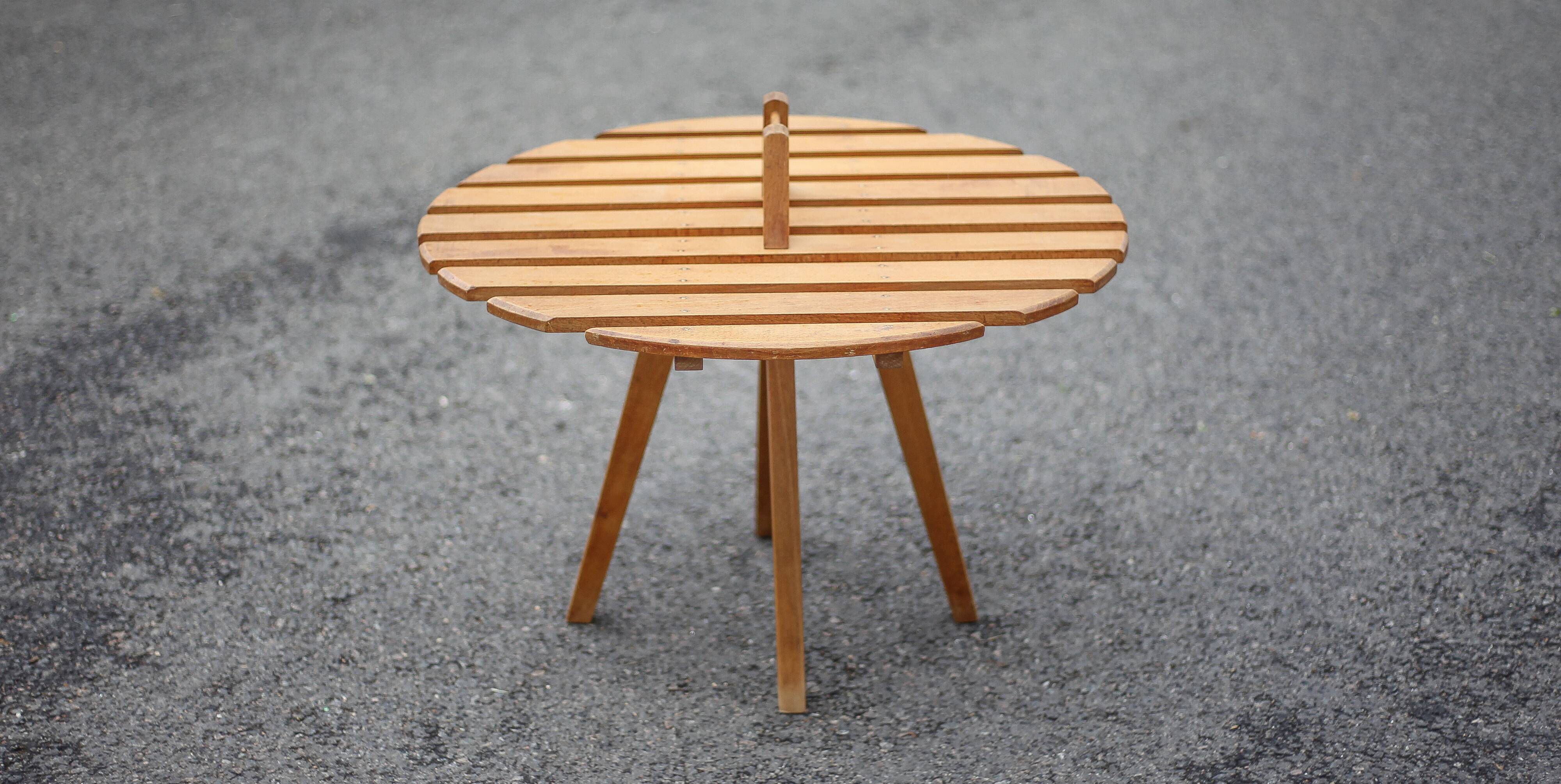 Vintage coffee table, wooden table with central handle, interior decoration, terrace, patio