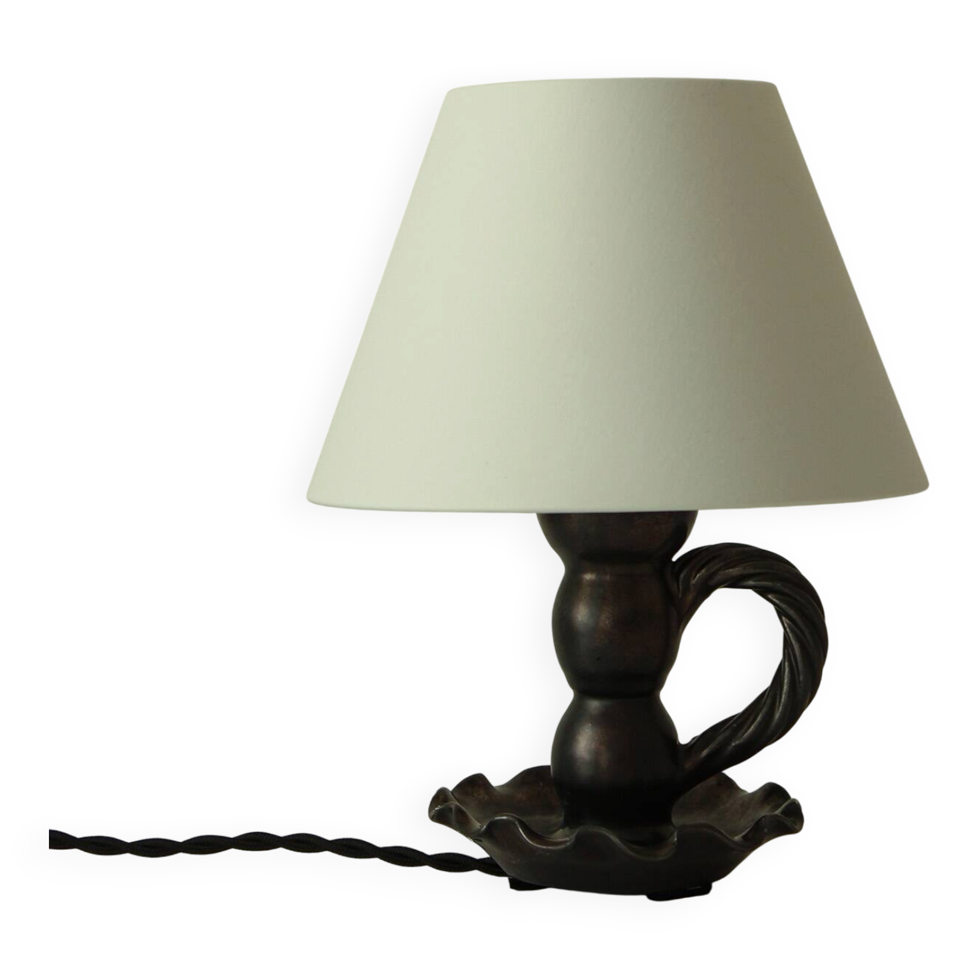 Black ceramic lamp shaped like a candlestick.
